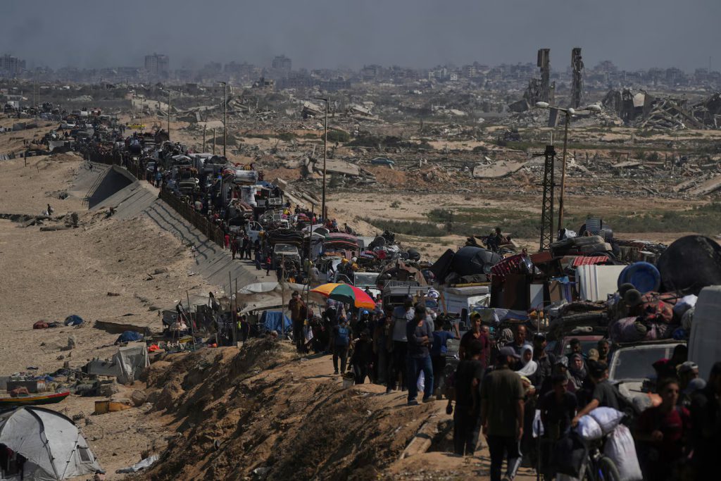 Displaced Palestinians flee northern Gaza along the coastal road toward the south in September 2025. (Abdel Kareem Hana/AP)